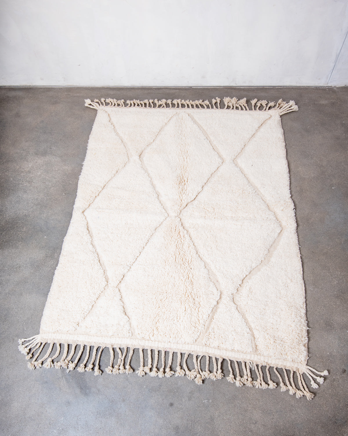 Modern, designer, handcrafted Berber rug from Morocco. Beniourain carpet with minimalist design, natural wool pile and a fluffy texture.